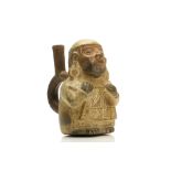 A MOCHE POTTERY FIGURAL VESSEL Depicted as a standing figure, with details added in paint, wearing a