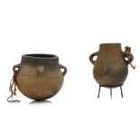 TWO TRIBAL CLAY POTS Each decorated with impressed decoration, the larger vessel with four handles