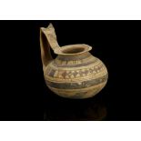 A DAUNIAN VESSEL 6th Century B.C.-4th Century B.C. Decorated with umber and black encircling bands