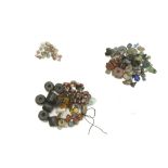 A GROUP OF GLASS AND STONE BEADS Roman to Islamic Period and later Including various mosaic glass