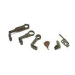 FIVE ROMAN BRONZE AND IRON KEYS Circa 1st-4th Century A.D. and one hook mechanism, 2.8cm-7cm long (