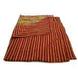 A KENTE CLOTH, GHANA Composed of a burgundy background with yellow, blue and green stripes and a