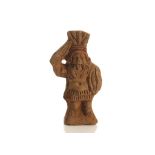 A ROMANO-EGYPTIAN TERRACOTTA STATUETTE OF BES Circa 1st Century B.C./A.D. Wearing the garb of a