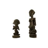 TWO WOOD FIGURES, ANGOLA The first sat cross-legged, 60cm high; the other with the knee raised and