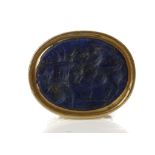 A ROMAN LAPIS LAZULI INTAGLIO Circa 1st Century A.D. Depicting a goat standing next to a cornucopia,