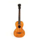 A 19th century parlour guitar , figure 8 peg head.. The table is decorated with delicately painted