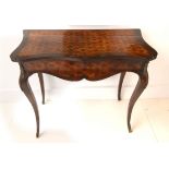 An early 19th Century kingwood and marquetry gilt metal mounted side table, of serpentine outline,