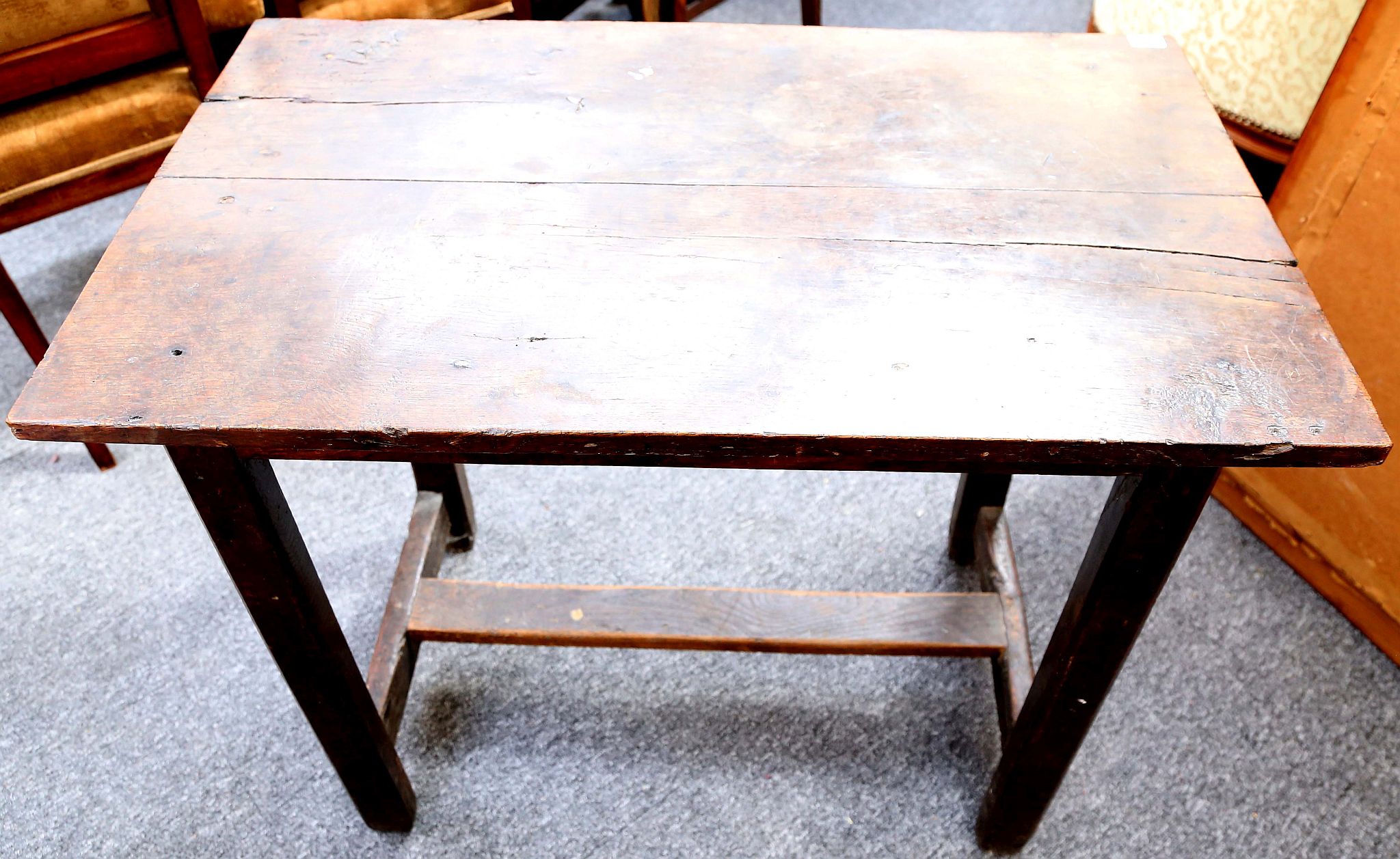 A rectangular oak side table, on square legs with 'H' stretcher, 87cm. (Constructed from old