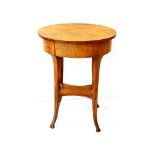 An early 19th century oval Continental fruitwood side table, fitted drawer on angular downswept legs