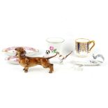 A German Hutschenreuther porcelain lustre glazed model of a dog, a Rosenthal miniature model of a