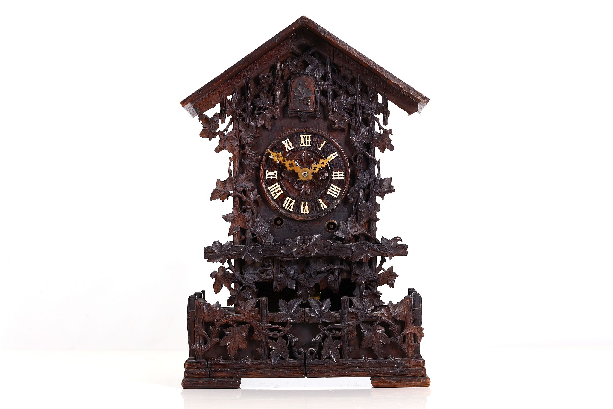 WITHDRAWN A 19TH CENTURY BLACK FOREST CARVED WOOD CUCKOO CLOCK of typical form with pitched roof