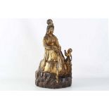 A Chinese parcel giltwood carving of a seated Guanyin with boy attendant in prayer, 60cm high.