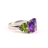 ***WITHDRAWN*** An 18ct white gold, peridot and amethyst 2 stone dress ring. ***WITHDRAWN***