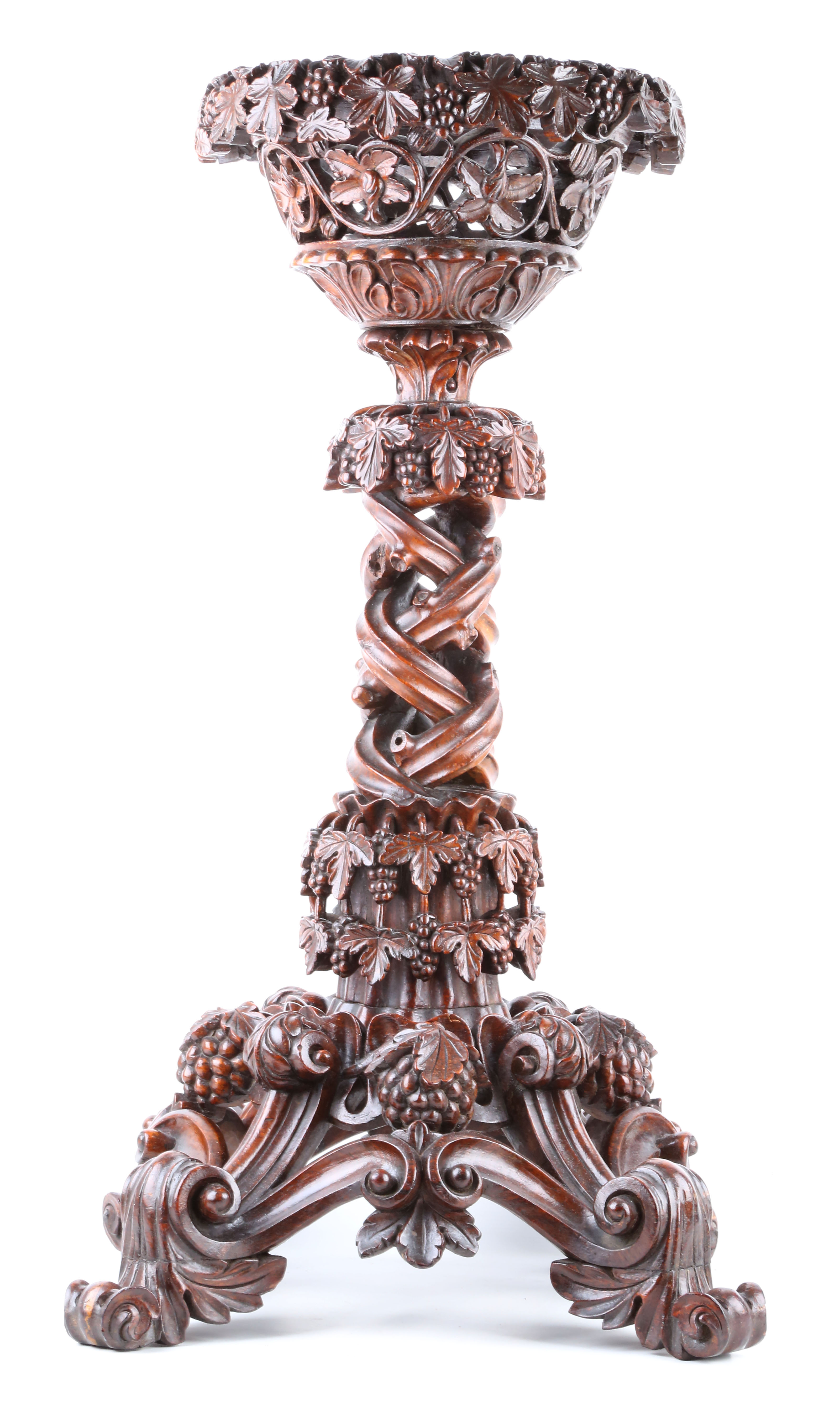 A fine 19th century Indian export carved hardwood jardiniere / plant stand the top basket carved