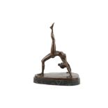 After Bruno Zach, 20th Century bronze, in the form of a female gymnast, on marble base, 30cm wide.