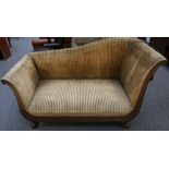 An early Victorian mahogany day bed, formerly with a drop end, upholstered in striped fabric, on