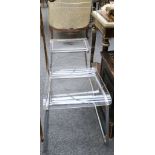 A set of six contemporary tubular chrome and perspex dining chairs.