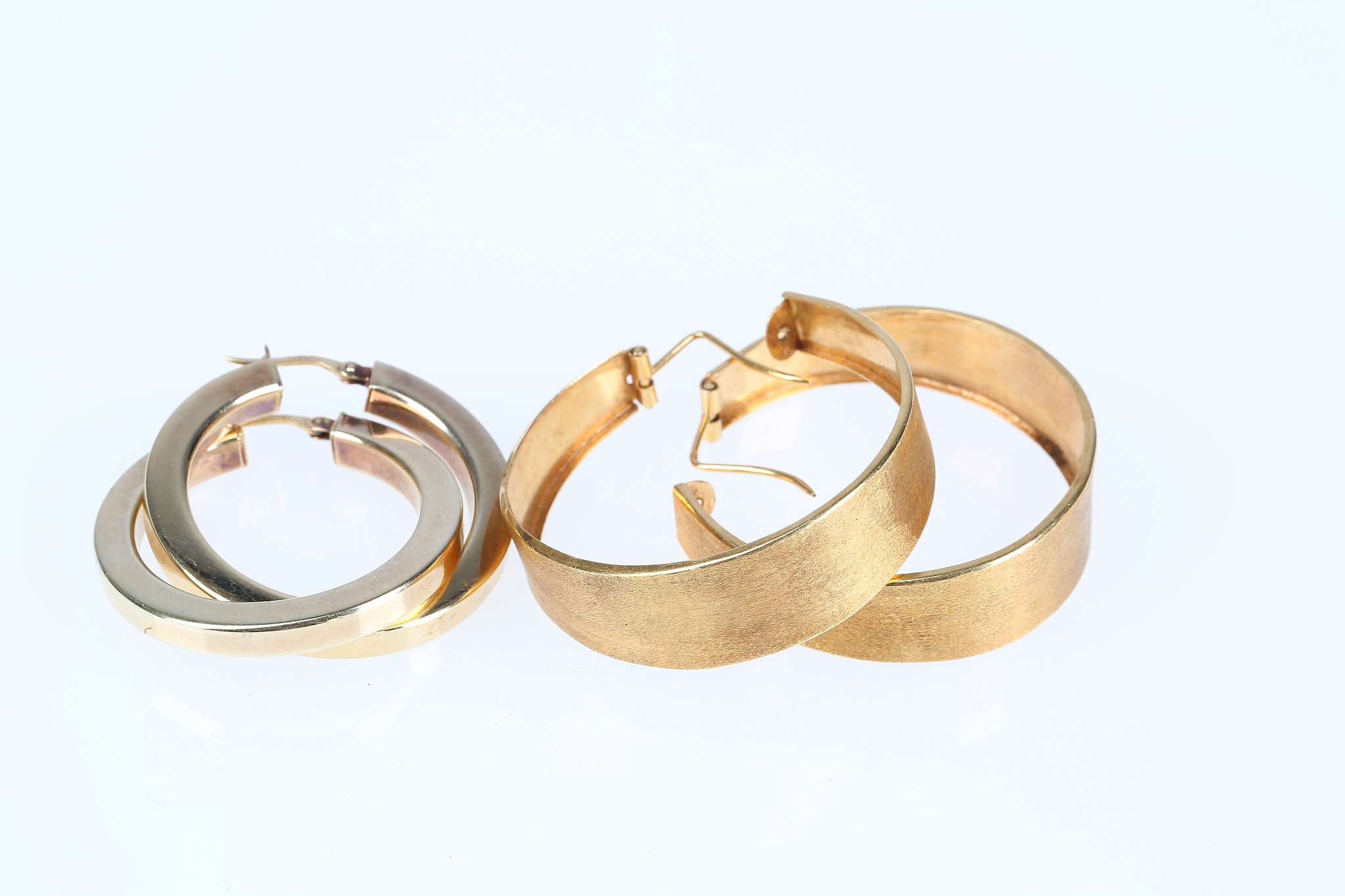Two pairs of hoop earrings, One of wide brushed design, stamped 18K, the other of silver gilt, - Image 2 of 4