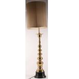 A MID 20TH CENTURY BRASS FLOOR LAMP, of turned designed (145cm high).