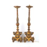 A pair of antique, possibly Italian, carved wood polychrome and parcel gilt candle holders, fitted