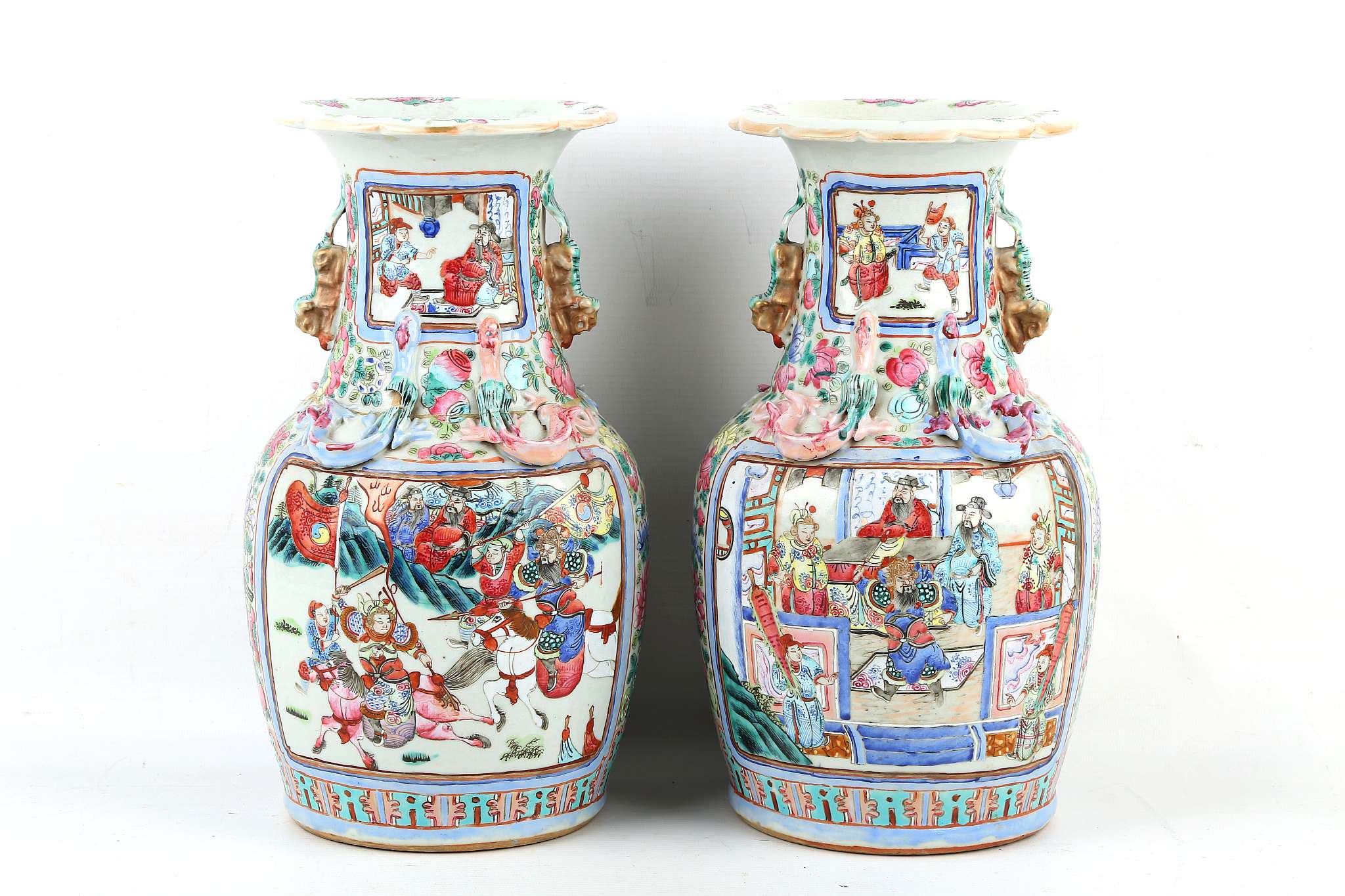 A pair of Chinese famille rose Canton vases with Buddhist lion dog handle and for 'Qi' dragons to