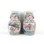 A pair of Chinese famille rose Canton vases with Buddhist lion dog handle and for 'Qi' dragons to