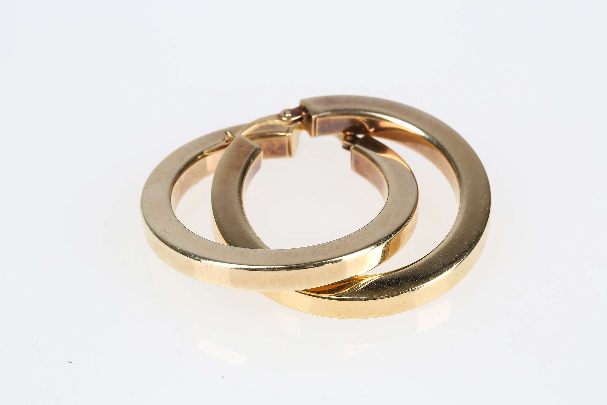 Two pairs of hoop earrings, One of wide brushed design, stamped 18K, the other of silver gilt, - Image 3 of 4
