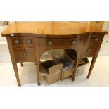 A George III mahogany serpentine fronted sideboard, circa 1790 composed of two pairs of short