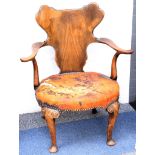 An antique Queen Anne revival walnut armchair