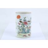 A late 19th / early 20th Century Chinese porcelain brush pot, enamelled to one side with flora and
