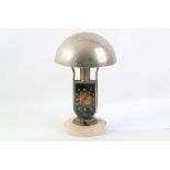 An Art Deco Mofem nickel plated bedside alarm timepiece, combined lamp with conical shape on