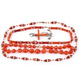 A collection of carnelian jewellery, Including three necklaces, one of faceted beads, and a silver