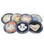 Seven vintage Chinese embroidered circular panels, approx. 26cm diameter, all with individual