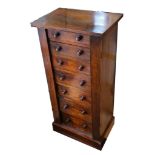 A Victorian walnut Wellington chest, fitted with 7 graduated drawers with single locking bar on