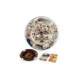 A 20th Century large Continental semi-porcelain charger, enamelled with Imari type decoration,