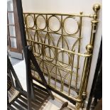An early 20th Century Gothic revival style, heavy brass and cast iron bed, 143cm high.