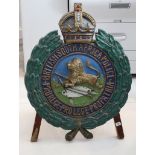 A mid 20th Century, British South Africa Police, cast metal wall plaque, 85cm high, on a later easel