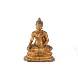 A gilt bronze seated figure of a Buddha, 21cm high.