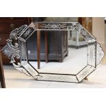 Early 20th Century, Venetian engraved glass wall mirror of octagonal form with open scroll pediment,