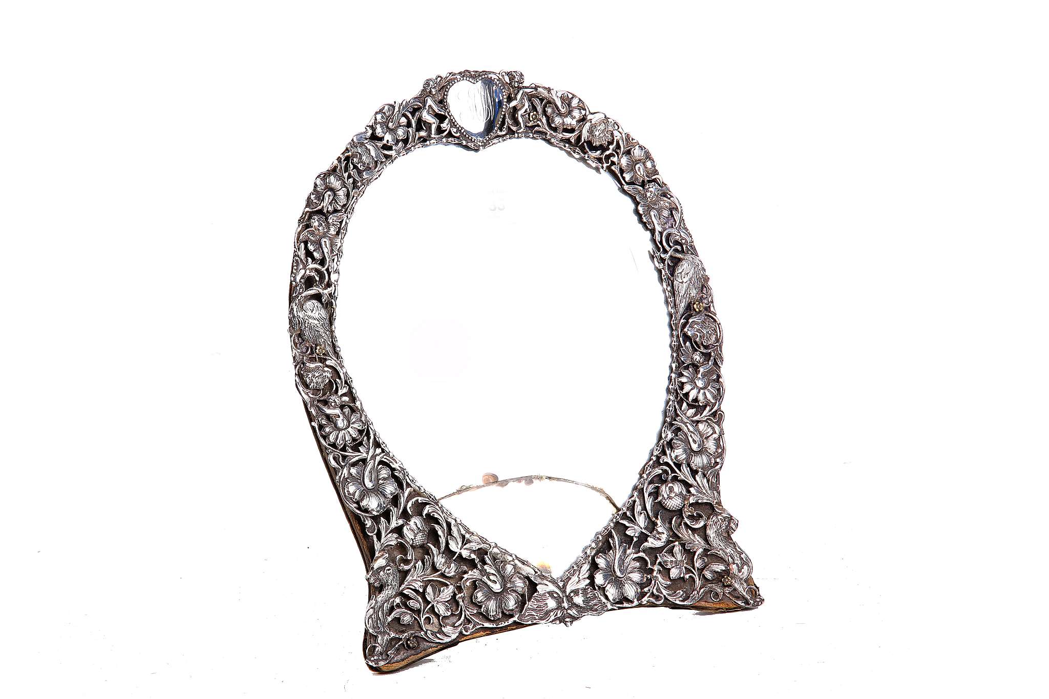 A Victorian silver mounted easel dressing table mirror, embossed flower heads and leaves around a