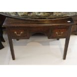 A 19th Century ladies oak plank top knee-hole writing desk, fitted with two drawers.