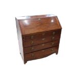 A George III mahogany bureau, with inlaid pigeon hole interior over four graduated long drawers,