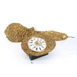 An early 20th Century, French comtoise wall clock, decoratively pressed brass, having white enamel
