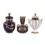 A Royal Crown Derby bone china twin-handled vase and cover, applied in gilt with green lustre