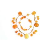 An amber and coral resin necklace, Designed as a fringe of polished beads, possible partial