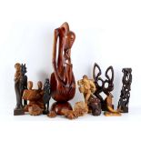 An interesting collection of carved wooden tribal figures, modelled as stylised figures, animals