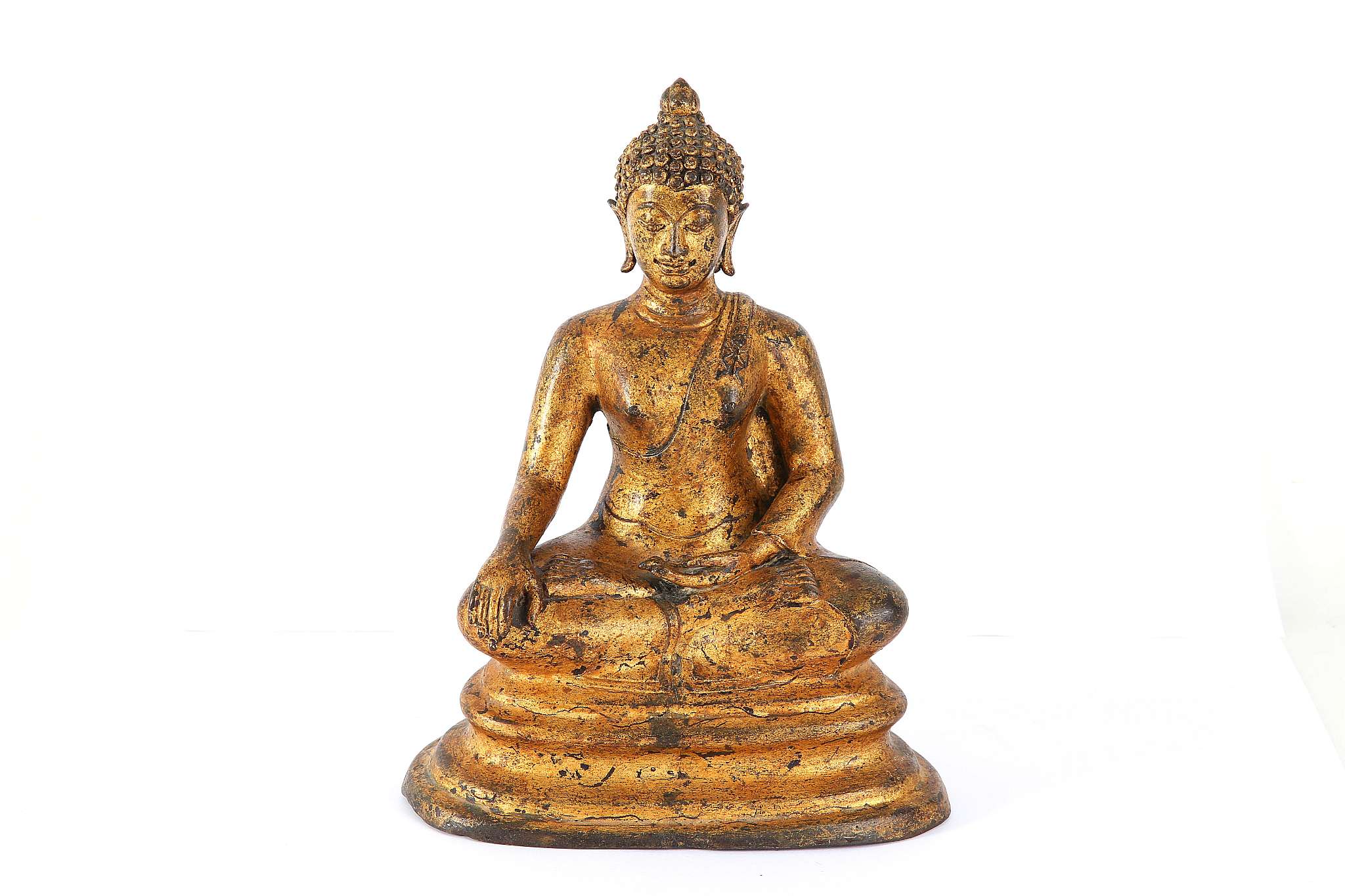 A gilt bronze seated figure of a Buddha, 21cm high.
