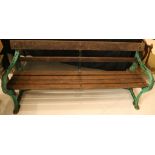 A vintage cast iron and wooden slatted garden bench, 180cm long.