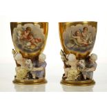 A FINE PAIR OF BERLIN PORCELAIN FIGURAL GOBLETS, late 19th century, the gilt-ground bowls