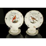 A PAIR OF MEISSEN PORCELAIN ORNITHOLOGICAL TEA CUPS AND SAUCERS, late 19th century, painted with
